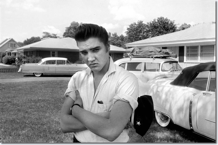 Elvis in the front yard of his home at 1034 Audubon Drive in May 1956