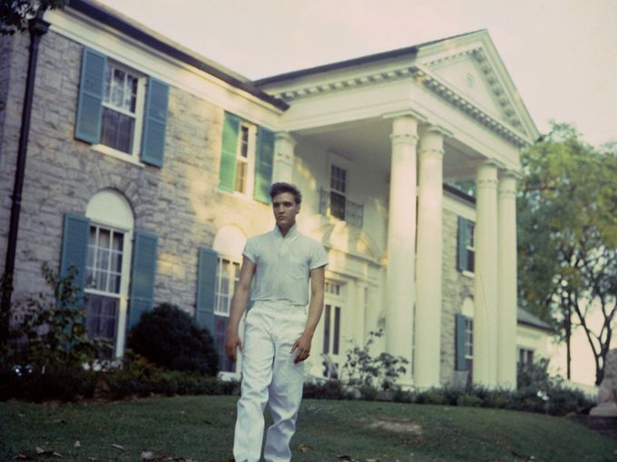 Elvis Presley in front of Graceland in 1957 